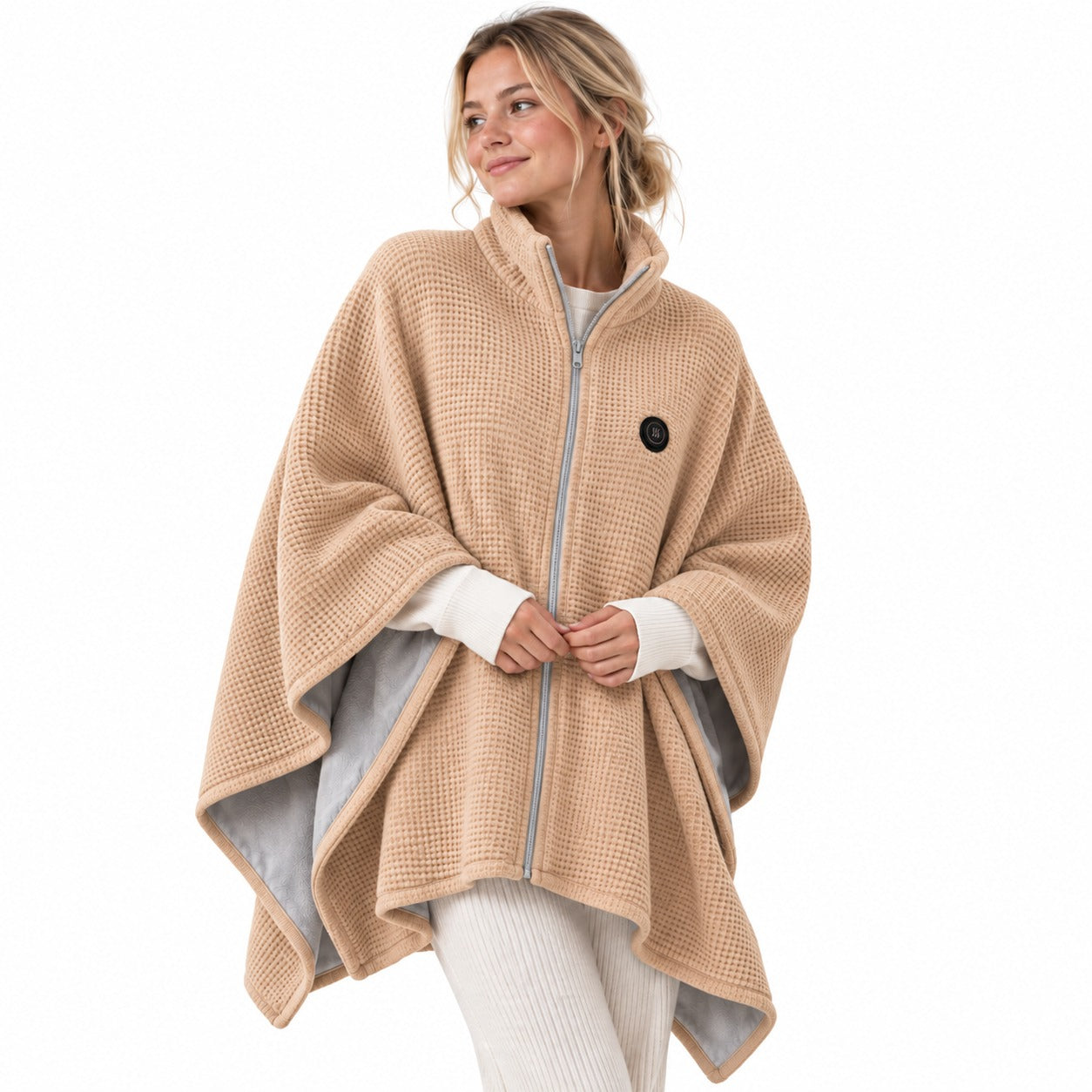 Beige wearable heated blanket shawl worn over casual clothing