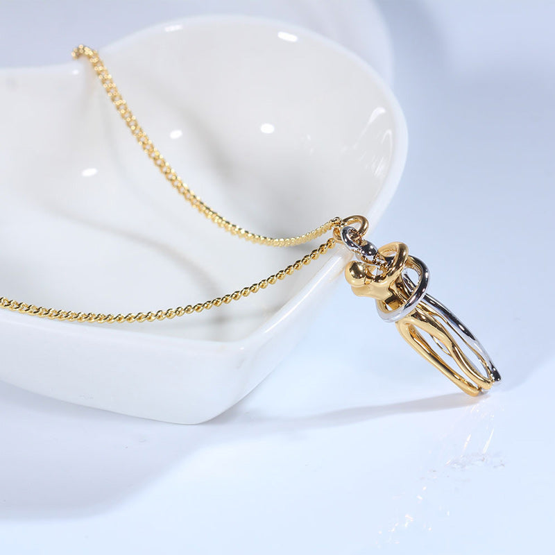 Couple hugging necklace